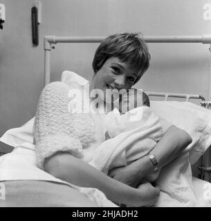 Actress Julie Andrews of 'My Fair Lady' fame pictured in the London Clinic with her new baby daughter which she will name either Emma, Kate, Sarah or Joanna. It was also announced today that Julie will make her film debut in Walt Disney's 'Mary Poppins.' 28th November 1962. Stock Photo