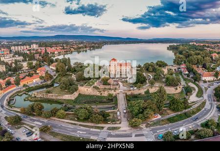 Aerial sunset view over the old lake of Tata with medieval castle surrounded by moat, bastions and walls in Hungary Stock Photo