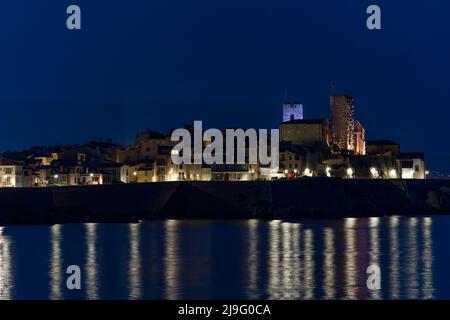 View of sea port in Cannes,France and its old town at night Stock Photo