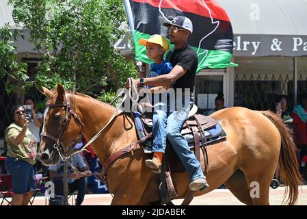 African American cowboys parade on horseback through Zebulon, NC, as part of a weekend long Juneteenth celebration of emancipation from slavery. Stock Photo