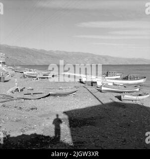 41. Spain. Photo journal is available at B.M.A. + Photo albums. Acquisition: Books and archive materials. Photos taken 1959-11-12.12 Pictures in series. According to notes: Spain. S. Mediterranean coast, Castell de Ferro, 12/11-59. View of the landing site. A couple of boats are commissioned on a beach. Above the beach is a society. Stock Photo