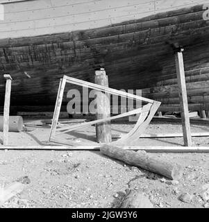 41. Spain. Photo journal is available at B.M.A. + Photo albums. Acquisition: Books and archive materials. Photos taken 1959-11-12.12 Pictures in series. According to notes: Spain. S. Mediterranean coast, ADRA, 12/11-59. Shipyards. A boat is at a boat lap. Against the boat there are two spant templates leaning. Stock Photo