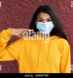 African american woman wearing medical mask Stock Photo