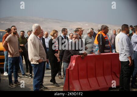 Nablus, Palestine. 26th Oct, 2022. Palestinians wait at a closed Israeli checkpoint in the occupied West Bank city of Nablus, during a visit by a diplomatic delegation from 17 countries that recognize Palestine to learn about the suffering of the Palestinian people at these checkpoints. Residents of the city said that these checkpoints are closed for the seventeenth consecutive day by the Israeli army. (Photo by Nasser Ishtayeh/SOPA Images/Sipa USA) Credit: Sipa USA/Alamy Live News Stock Photo