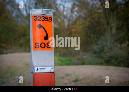 Emergency sos phone on an all lanes running stretch of the M1 motorway, England. Stock Photo