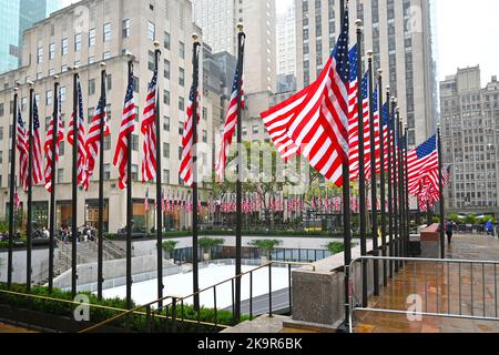 NEW YORK - 24 OCT 2022: Flags surround the Ice Rink at Rockefeller Center, in Midtown Manhattan. Stock Photo