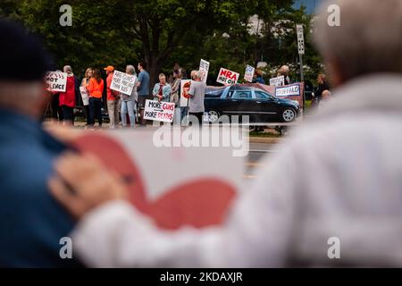 Demonstrators attend a candlelight vigil in Fairfax, VA, for the victims of the Uvalde and Buffalo massacres, May 25, 2022. On May 24, a gunman entered Robb Elementary school and killed 19 students and 2 teachers in the worst school shooting since Sandy Hook in 2012. Despite hundreds of mass shootings and thousands of gun-related deaths each year, Congress and the courts refuse to take action to stem the violence. (Photo by Allison Bailey/NurPhoto) Stock Photo