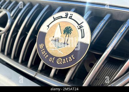 Impressions from Doha/Qatar on November 25th, 2022. State of Qatar emblem, sign, sign on the radiator grille of a car, Football World Cup 2022 in Qatar from 20.11. - 18.12.2022 ? Stock Photo