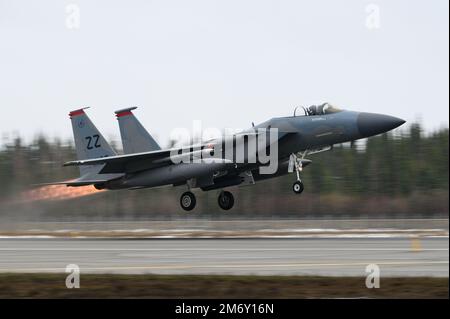 A U.S. Air Force F-15C Eagle assigned to the 67th Fighter Squadron takes off from Eielson Air Force Base, Alaska, during RED FLAG-Alaska 22-1, May 9, 2022. This exercise provides unique opportunities to integrate various forces into joint and multilateral training from simulated forward operating bases. Stock Photo