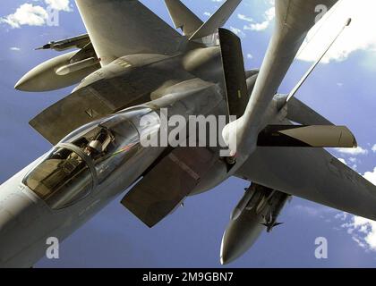 A F-15C Eagle from the 67th Fighter Squadron receives inflight fuel from a KC-135R Stratotanker from the 909th Air Refueling Squadron while on a routine training mission over the Pacific Ocean. Both units are stationed at Kadena Air Base, Japan. Base: Kadena Air Base State: Okinawa Country: Japan (JPN) Scene Major Command Shown: PACAF Stock Photo