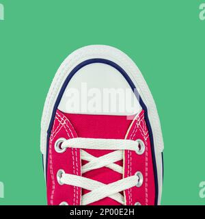 Retro Vintage Red Canvas Basketball Boots From Above On A Green Background Stock Photo