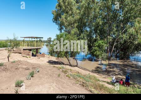 Douglas, South Africa - Mar 1, 2023: Anglers at Samevloeiing near Douglas where the Orange and Vaal Rivers join Stock Photo