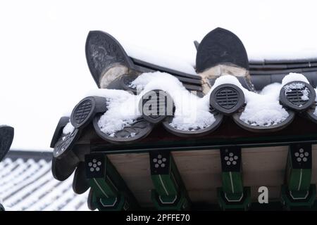 snow covered Korean traditional roof tile Stock Photo