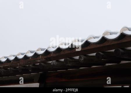 snow covered Korean traditional roof tile Stock Photo