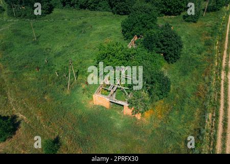 Belarus. Aerial View Of Ruined Cowshed In Chernobyl Zone. Chornobyl Catastrophe Disasters. Dilapidated House In Belarusian Village. Whole Villages Must Be Disposed. Chernobyl Resettlement Zone Stock Photo