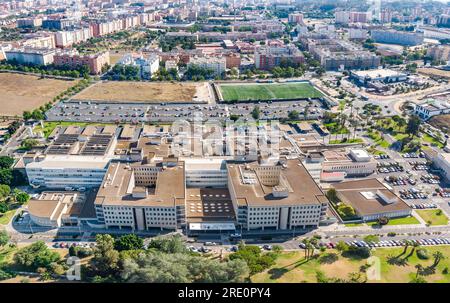 Aerial panoramic drone view of the Juan Ramon Jimenez University Hospital from emergencies side, a public hospital complex belonging to the Andalusian Stock Photo