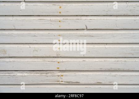 White horizontal wood siding of an old house , close up. Stock Photo