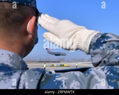 200218 -- BEIJING, Feb. 18, 2020 -- A transport aircraft of the People s Liberation Army PLA Air Force arrives at Tianhe International Airport in Wuhan, central China s Hubei Province, Feb. 17, 2020.  XINHUA PHOTOS OF THE DAY LixHe PUBLICATIONxNOTxINxCHN Stock Photo