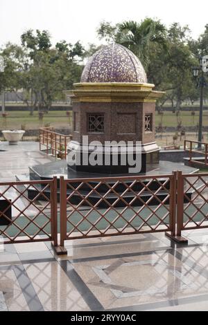 a small domed monument, with ceramic material surrounding it. Stock Photo