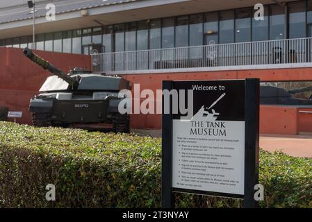 Sign and Challenger tank at the entrance to Bovington tank museum in England. October 2023 Stock Photo