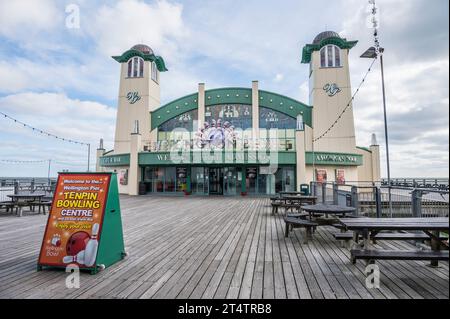 The image is of the typical English seaside holiday resort town of Great Yarmouth with the Wellington Pier entertainment building Stock Photo