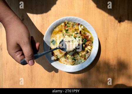 Chicken soup (Soto Ayam) is ready to serve. Traditional Indonesia food Stock Photo