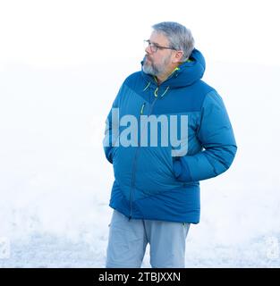 Middle age senior grey-haired doctor man wearing stethoscope and ... image.