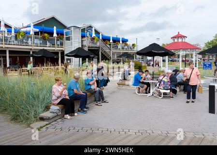 Visitors relaxing at Peakes Wharf, Charlottetown, Prince Edward Island, Canada Stock Photo