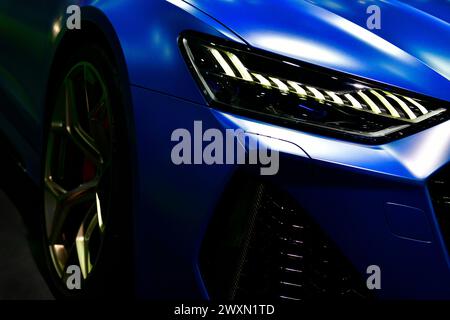 Front view of the LED headlights modern blue car Stock Photo