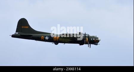 Vintage  B-17 Flying Fortress G-BEDF Sally B in flight blue sky. Stock Photo