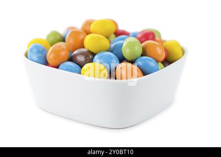 Portion of Cocolate coated Peanuts (as close-up shot) isolated on white background Stock Photo