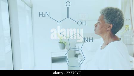 Image of element diagram over happy african american senior female patient in hospital room Stock Photo