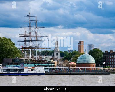 View over River Thames towards Cutty Sark British Clipper Ship and St. Alfege Church in Greenwich, London, England, United Kingdom, Europe Stock Photo