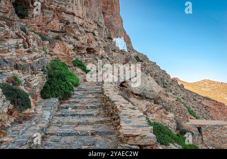 The stone steps leading to Hozoviotissa Monastery built in1017, that is lhanging on the cliff side, above the Aegean sea, in Amorgos, Cyclades, Greece Stock Photo