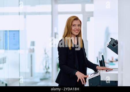 Blonde Businesswoman Using Printer in Office Setting. Stock Photo