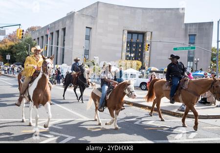 New York, New York, USA. 26th Oct, 2024. Members and friends on the NYC Federation of Black Cowboys ride during the annual Brooklyn Veteran's appreciation parade and Resource fair along Eastern Parkway near the Brooklyn Library in the Prospect Heights section of Brooklyn, New York (Credit Image: © Brian Branch Price/ZUMA Press Wire) EDITORIAL USAGE ONLY! Not for Commercial USAGE! Stock Photo