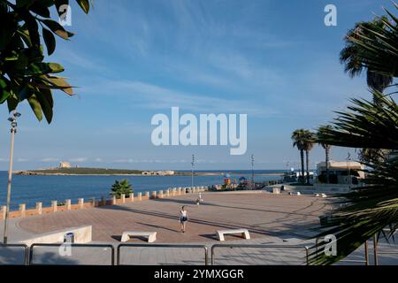 The small coastal town of Portopalo di Capo Passero, with Capopassero Island in the distance, in South East Sicily, Italy. Photo credit: Sam Mellish Stock Photo