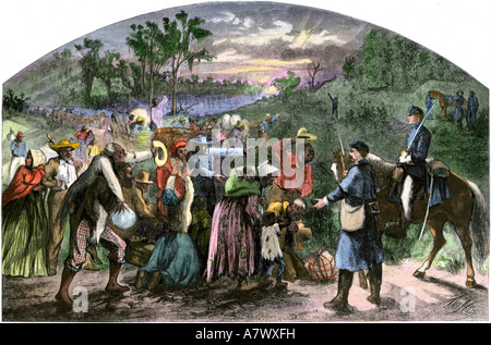 Freed slaves reaching Union Army lines after the Emancipation Proclamation 1863. Hand-colored woodcut Stock Photo