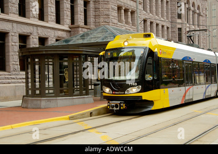 a light rail mass transit train in front of the government plaza in Minneapolis MN Stock Photo