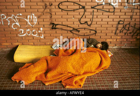 Two boys who are homeless sleeping in the streets of Buenos  Aires Argentina South America 2002 2000s HOMER SYKES Stock Photo