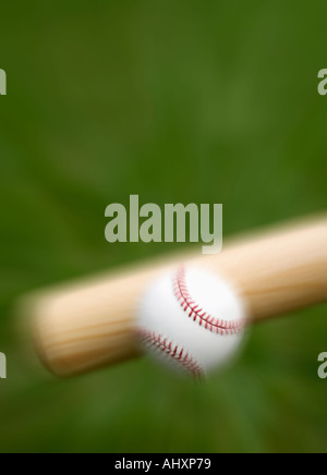 Closeup of bat hitting baseball Stock Photo