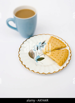 China mug of tea with shortbread biscuits Stock Photo