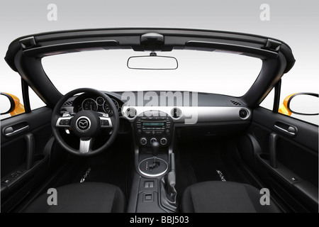 2009 Mazda MX-5 Sport in Yellow - Dashboard, center console, gear shifter view Stock Photo