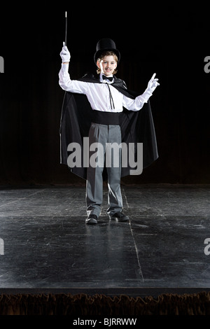 A boy pretending to be a magician Stock Photo