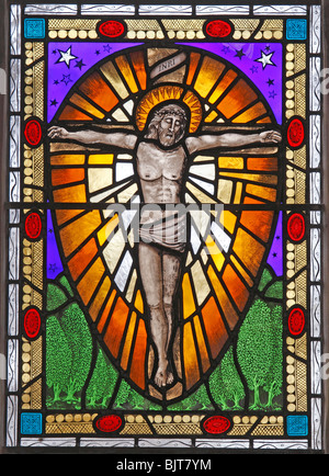 A modern stained glass window depicting the Crucifixion by Sarah Bristow, St Mary's Church, South Walsham, Norfolk Stock Photo