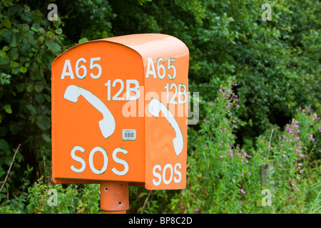 An emergency breakdown phone on the A65 near Settle, Yorkshire, UK. Stock Photo