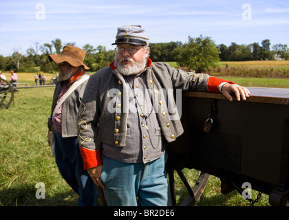 American Civil War reenactor standing next to a limber Stock Photo