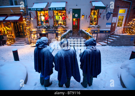 Christmas carolers on Rue du Petit Champlain in lower Old Quebec City, Canada Stock Photo