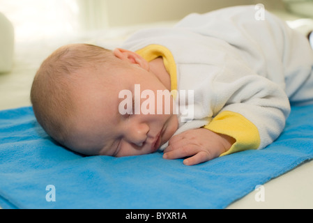 Sleeping 2 month old baby boy. Parent model released Stock Photo