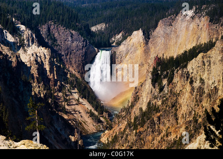 Horizontal view of a rainbow that forms every morning under Yellowstone falls viewed from Artist Point Stock Photo